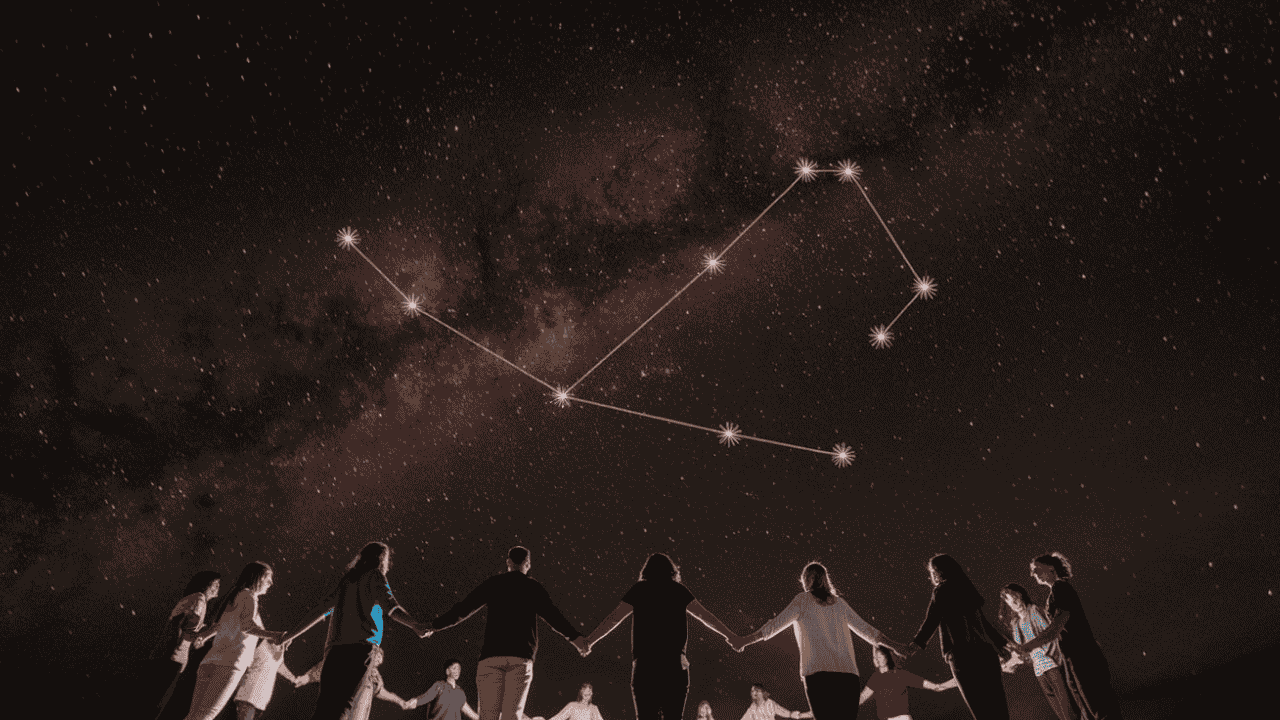 Group of people under a starry sky, holding hands and radiating light, symbolizing the unity and mission of starseeds.