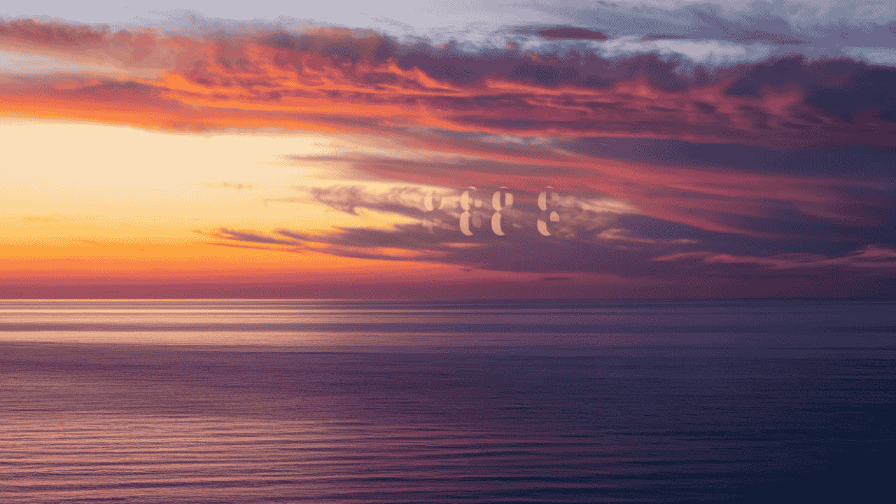 Sunrise over the ocean with the number 8888 in the clouds, symbolizing hope and abundance.
