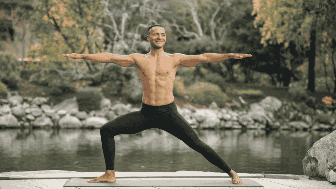 Yogi in Warrior II pose, symbolizing the physical and mental benefits of Ashtanga Yoga.